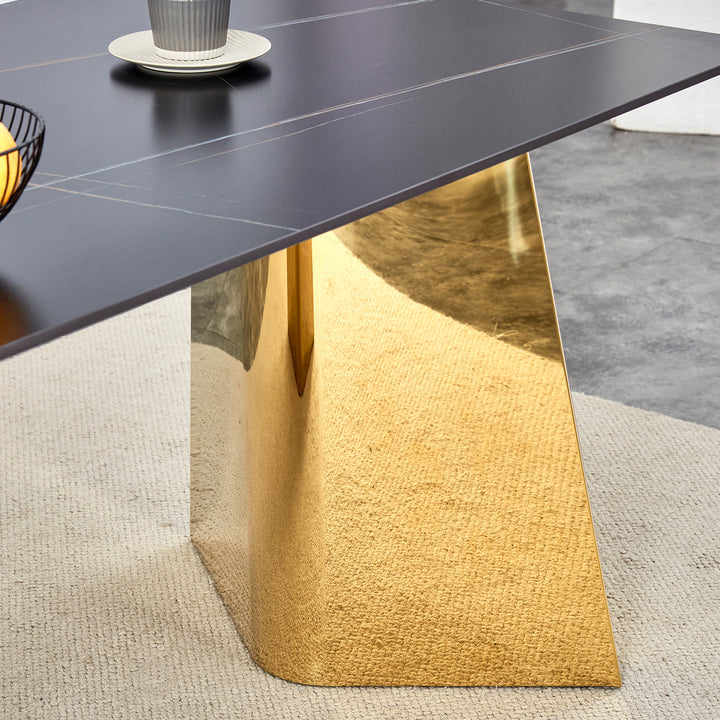 black-marble-patterned-slab-dining-table-with-golden-stainless-steel-butterfly-legs