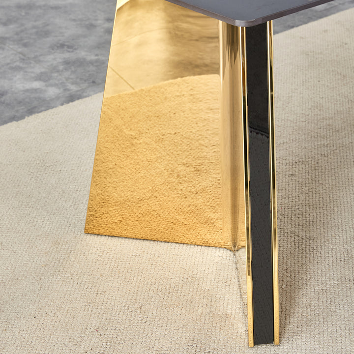 black-marble-patterned-slab-dining-table-with-golden-stainless-steel-butterfly-legs