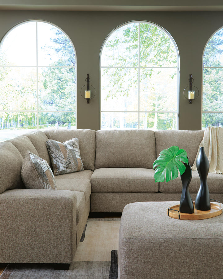 Newellen 3-Piece Sectional and Oversized Ottoman (9)