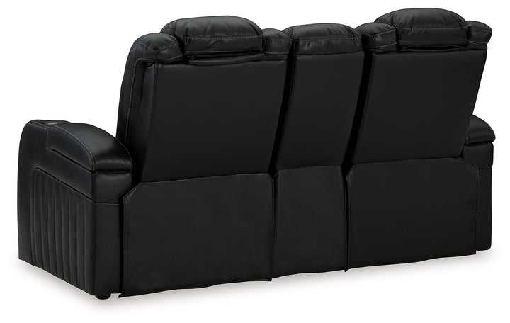 Caveman Den - Power Reclining Loveseat with Console/ Adj Hdrst - Midnight