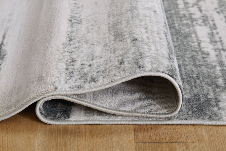 Abanett - 5' x 7' Rug - Gray