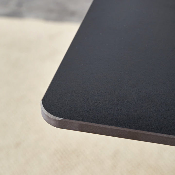black-marble-patterned-slab-dining-table-with-golden-stainless-steel-butterfly-legs