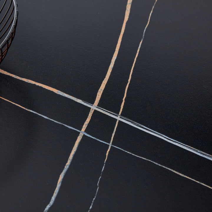 black-marble-patterned-slab-dining-table-with-golden-stainless-steel-butterfly-legs