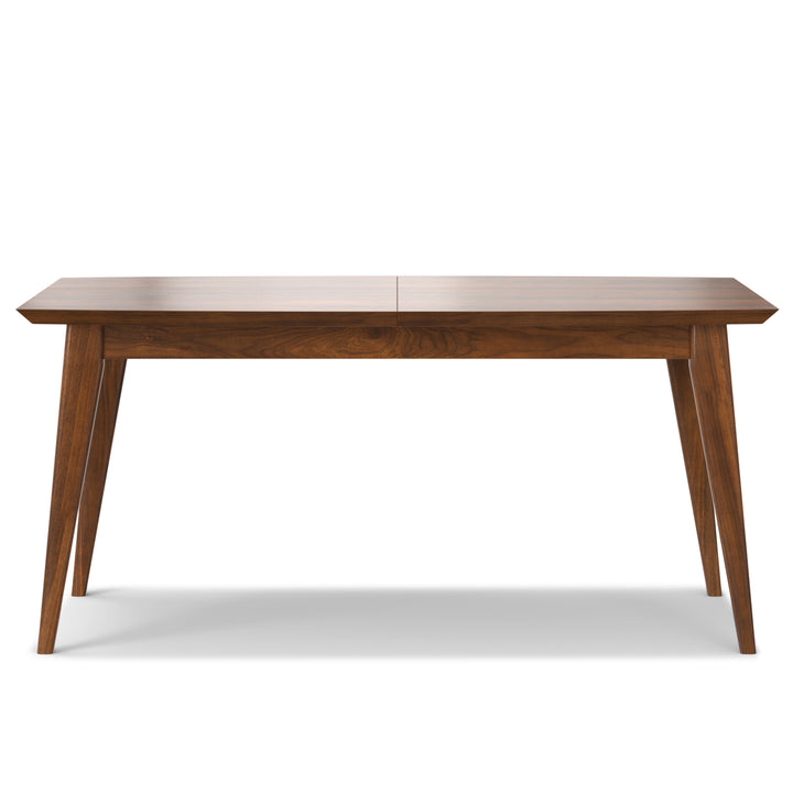 Elegant mid-century dining table in walnut veneer with hidden butterfly leaf.
