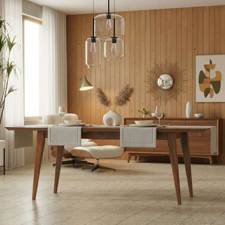 Elegant mid-century dining table in walnut veneer with hidden butterfly leaf.