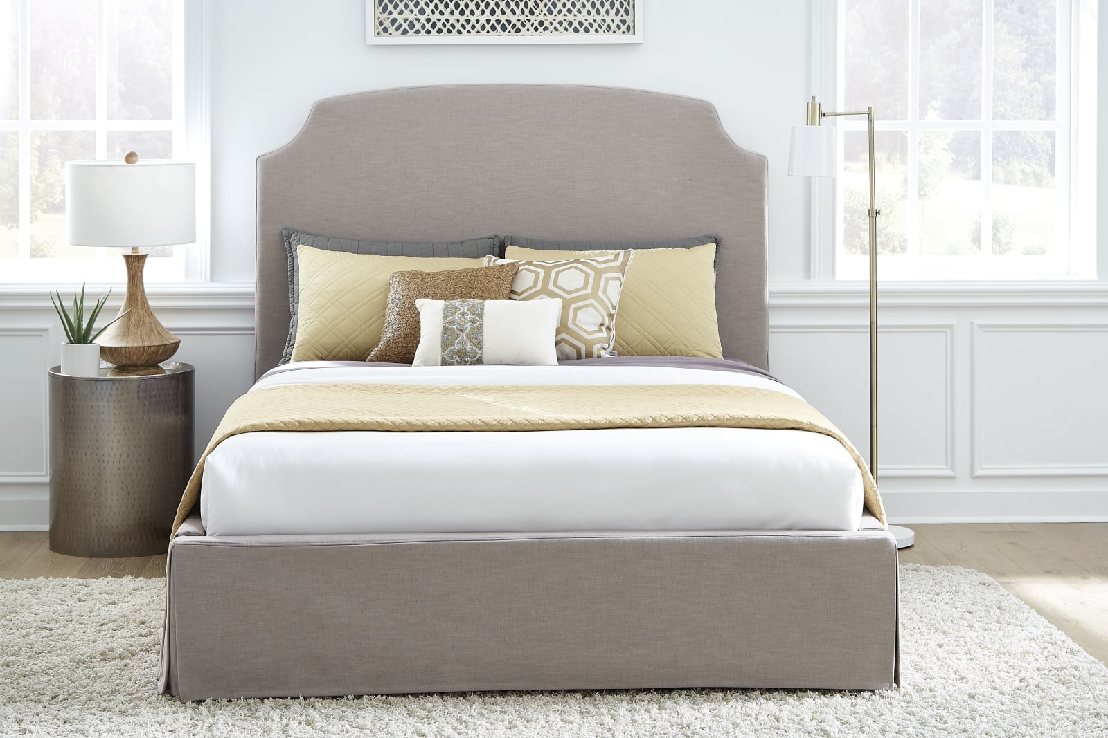 Laurel California King-Size Upholsterd Skirted Storage Panel Bed in Wheat