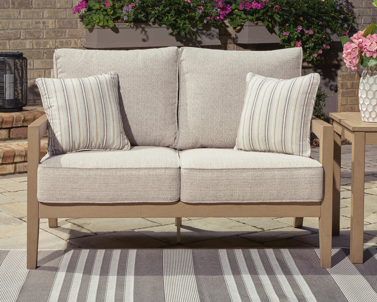 Hallow Creek Outdoor Loveseat with Cushion - Light Brown (2)