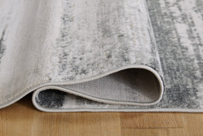 Abanett 5'3" x 7'3" Rug - Gray | Ashley Furniture