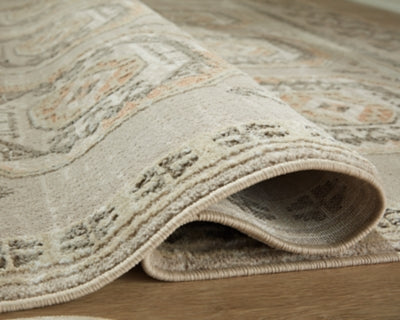 Bachby 5'3" x 7' Area Rug - Light Brown | Ashley Furniture