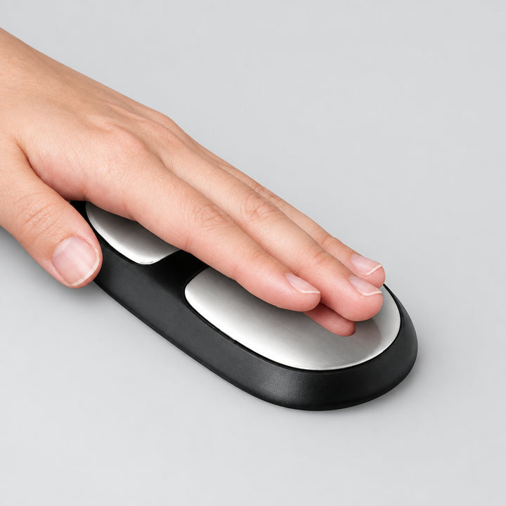 User placing hand on the integrated biometric AI health detection sensor on armrest