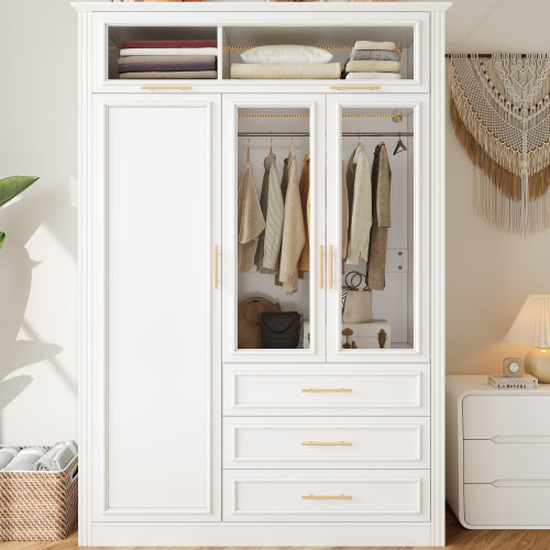 White wardrobe with glass doors displaying clothes, next to a nightstand with a lamp.
