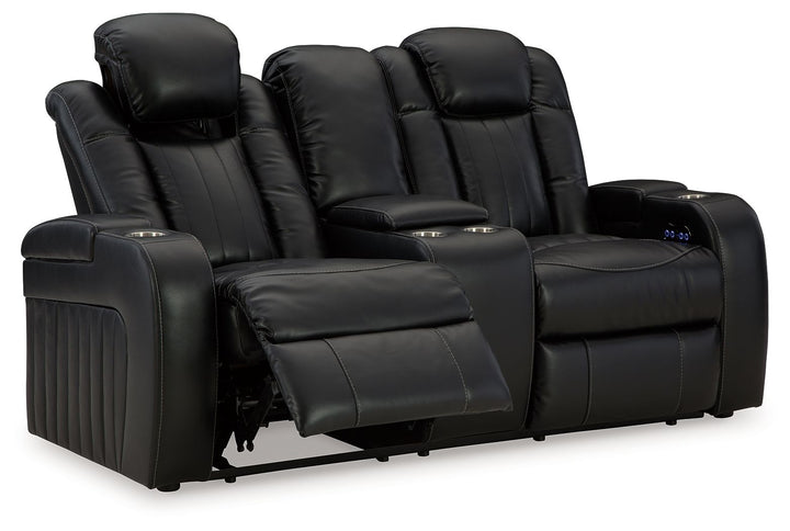 Caveman Den - Power Reclining Loveseat with Console/ Adj Hdrst - Midnight