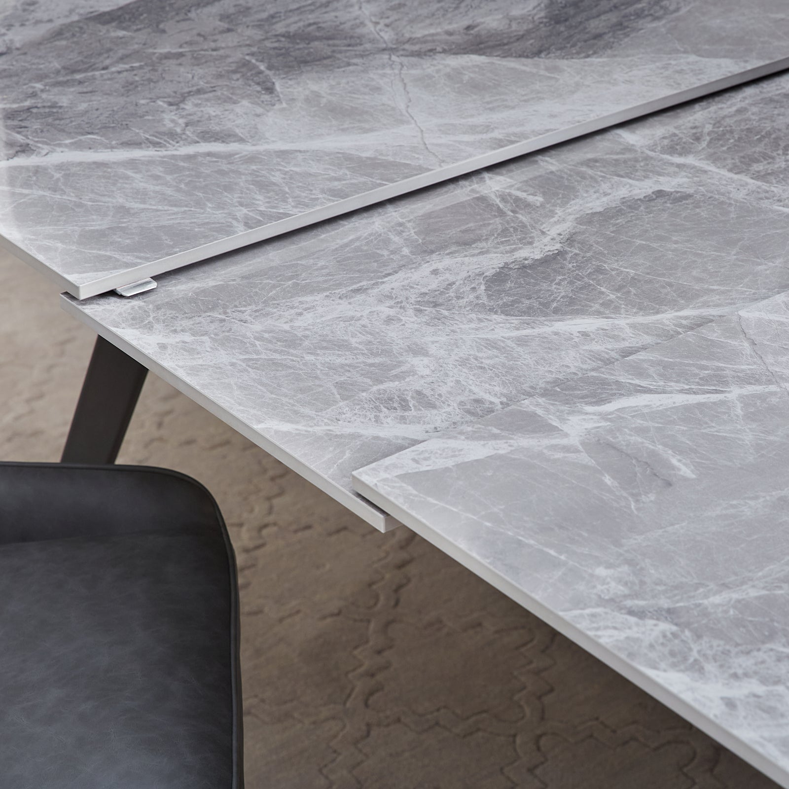 lucia-extendable-stone-top-metal-leg-dining-table-in-piedra-and-black