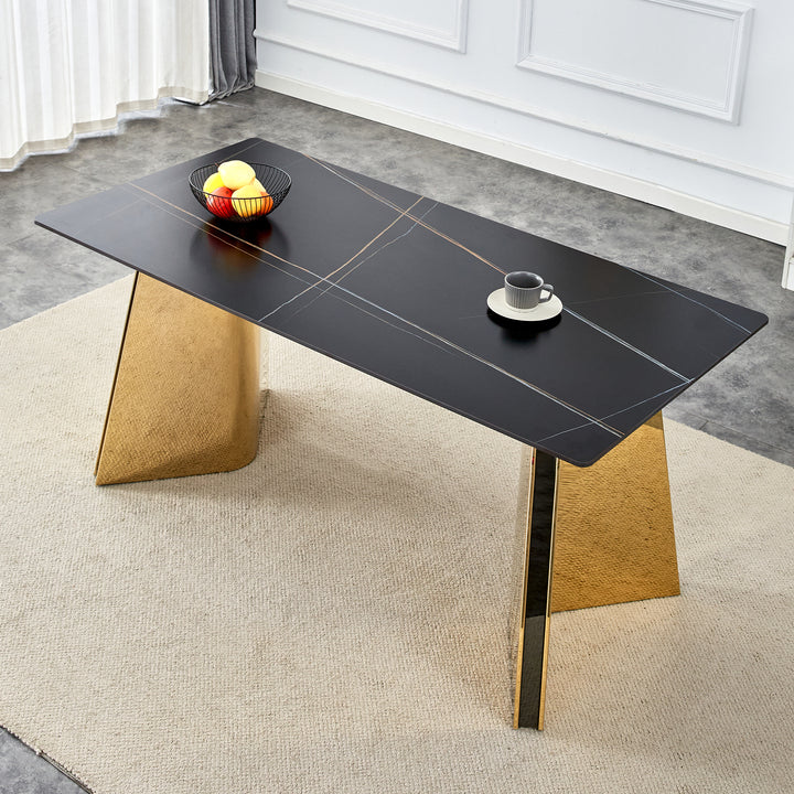black-marble-patterned-slab-dining-table-with-golden-stainless-steel-butterfly-legs