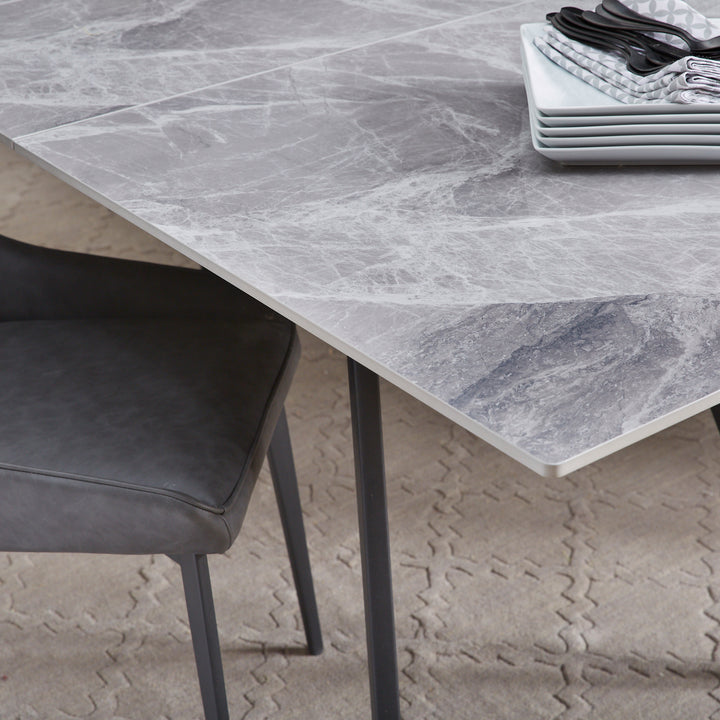 lucia-extendable-stone-top-metal-leg-dining-table-in-piedra-and-black