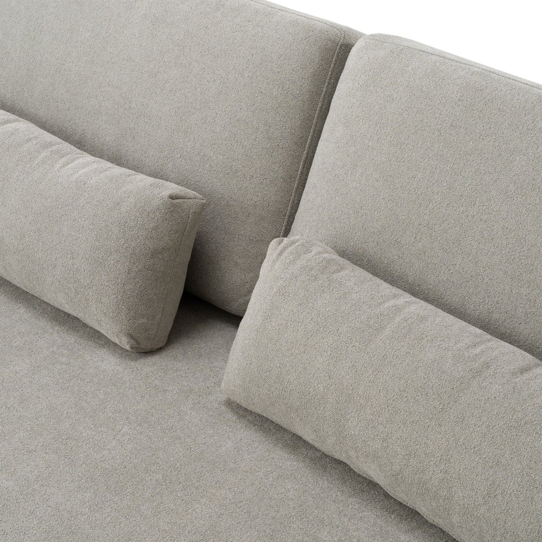 Gray fabric sofa with cushions on a light gray background
