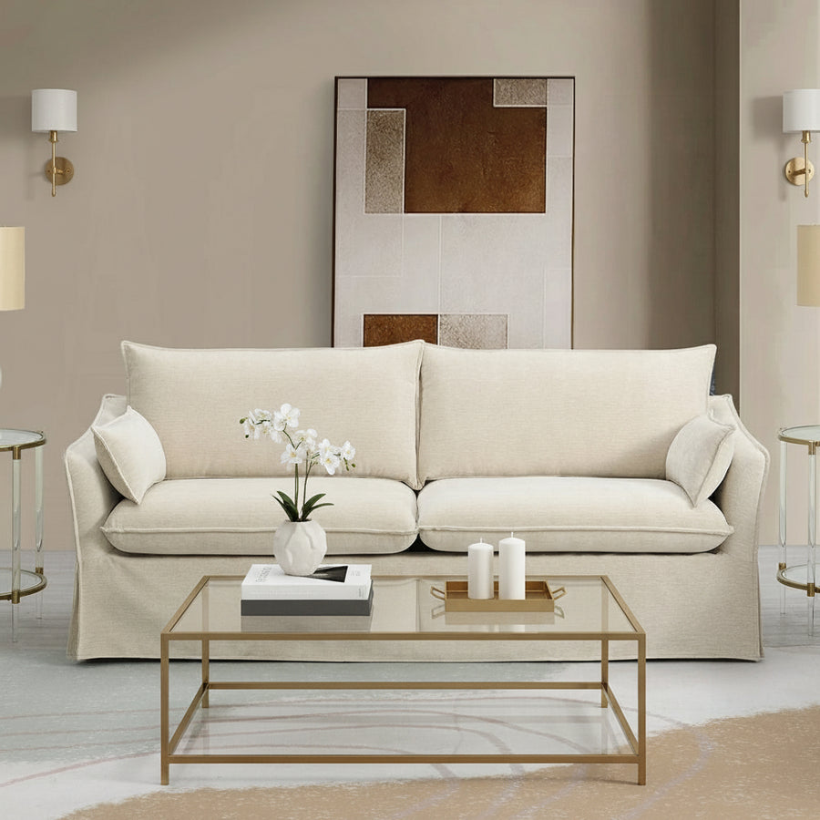 Beige sofa in a modern living room with abstract art on the wall.