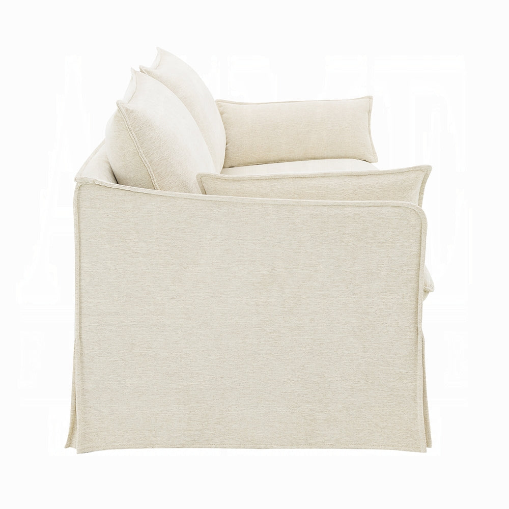 Beige armchair with cushions on a white background
