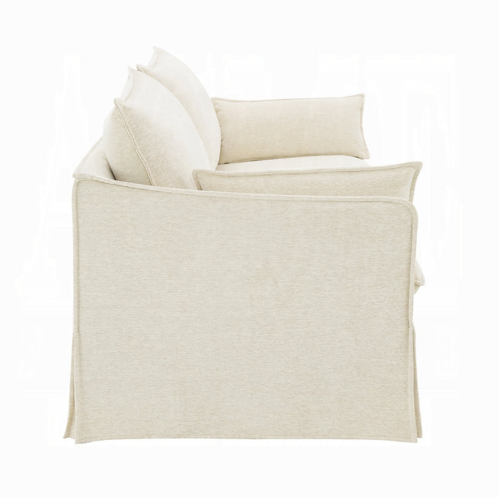 Beige armchair with cushions on a white background