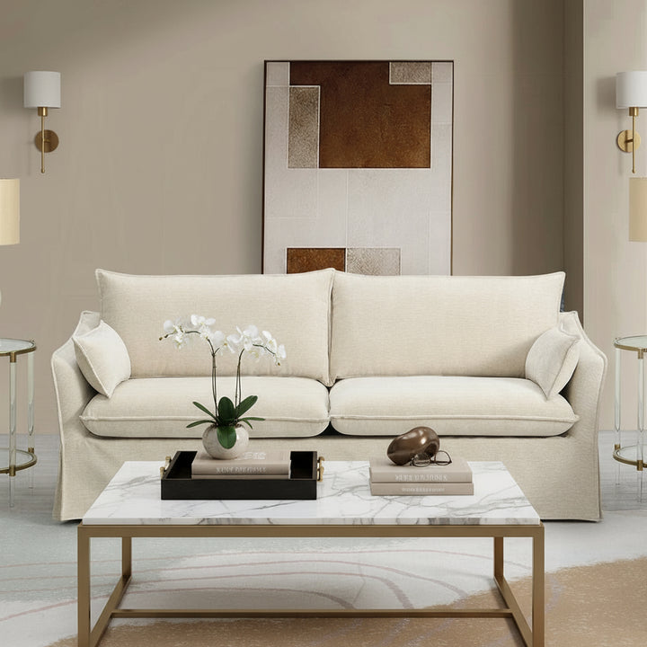 Beige sofa in a modern living room with abstract art on the wall.
