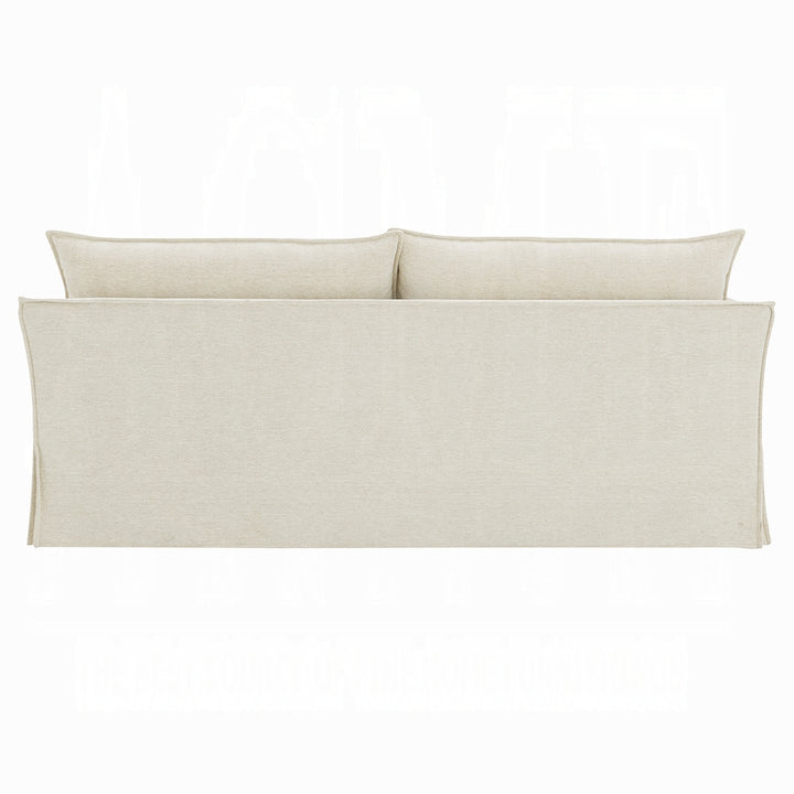 Set of three beige pillows on a white background