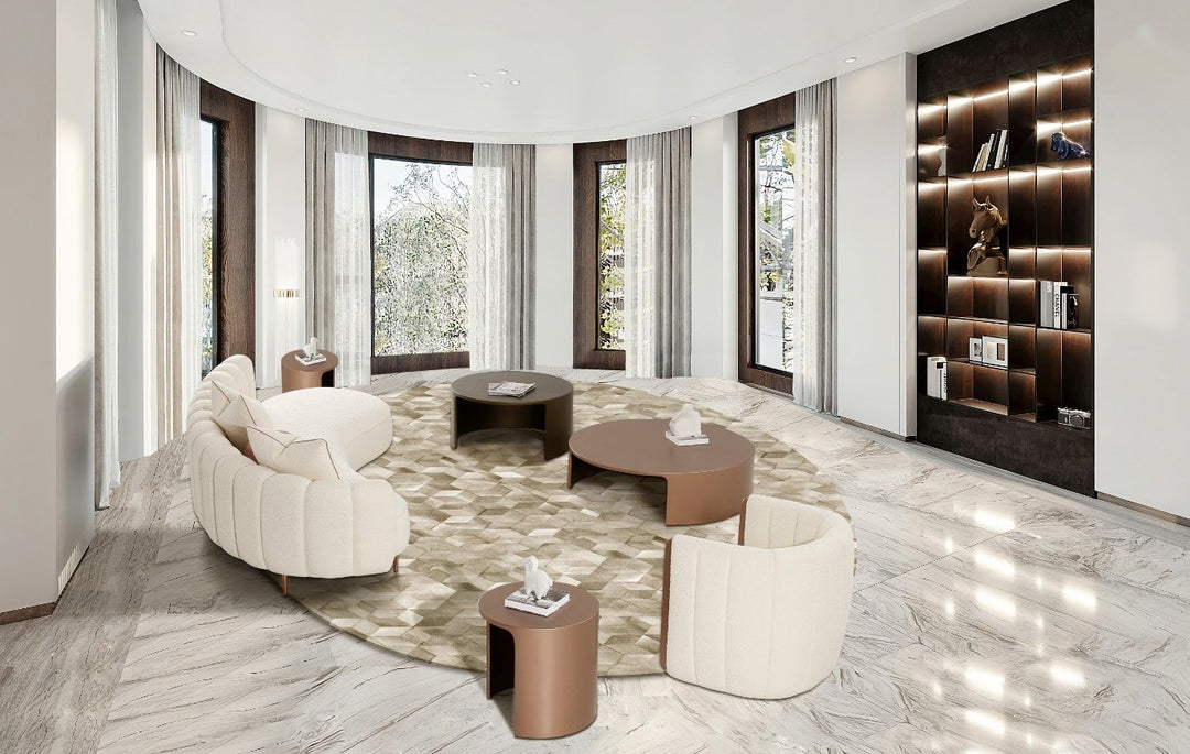Modern living room with round coffee tables and a bookshelf.