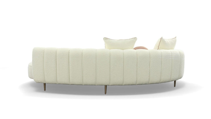 White sofa with quilted design on a white background