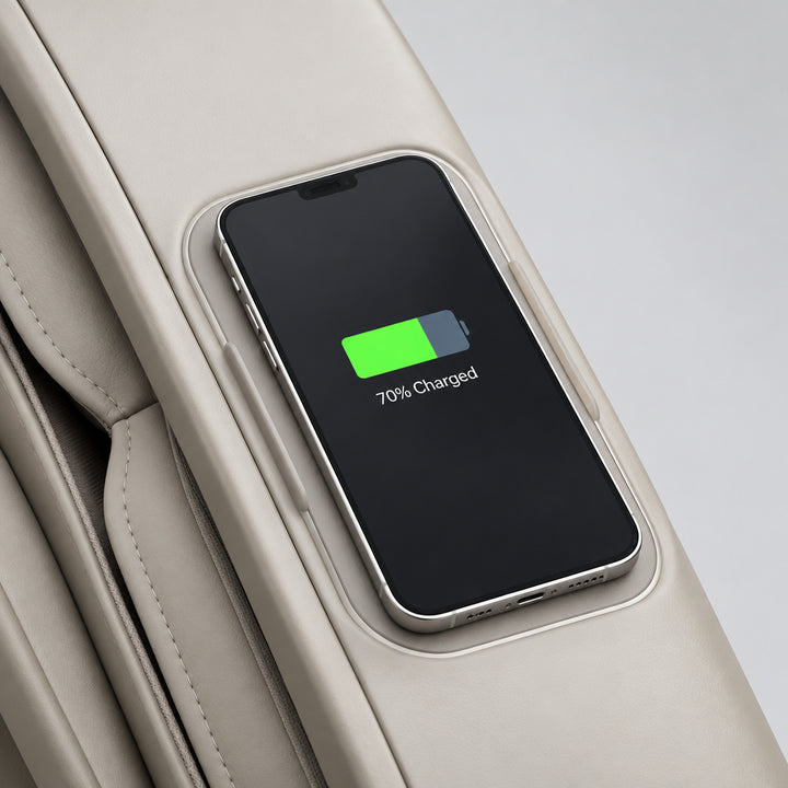 Built-in wireless smartphone charging pad with circular power status ring on the armrest.