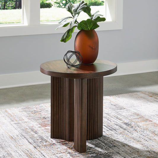 Signature Design by Ashley® Korestone Round End Table.